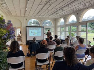 People Attending an Info Session at the Hui